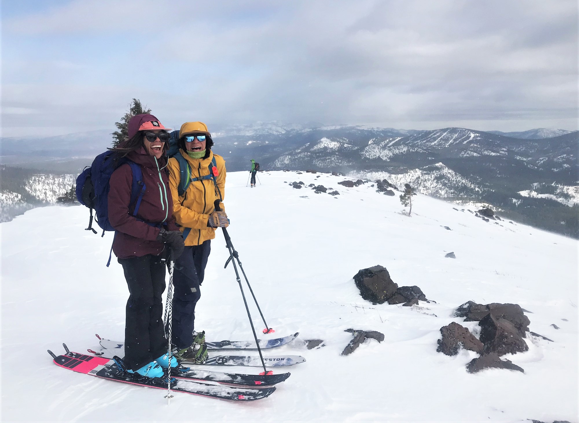 Two-women-of-color-backcountry-skiing-splitboarding-hut-trip