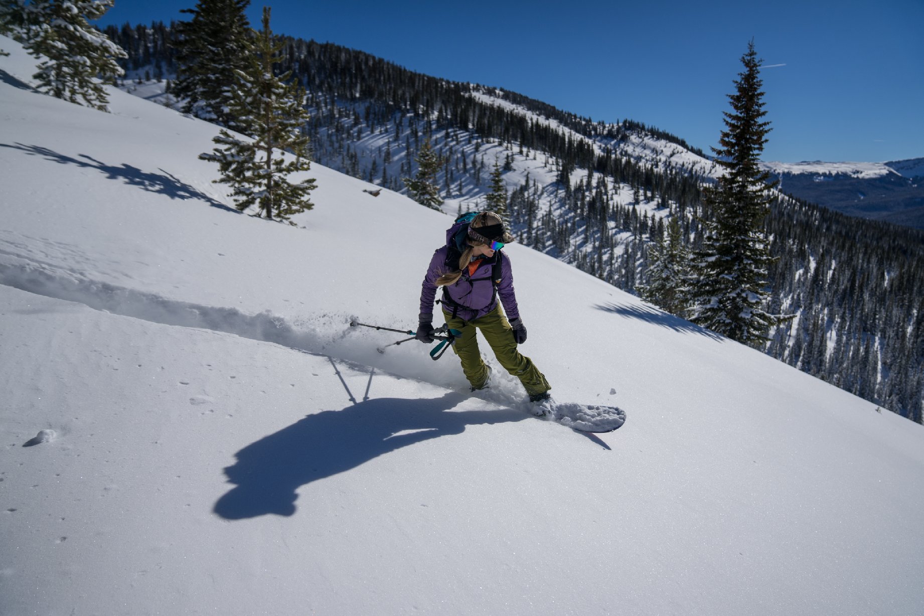 Sarah-MacGregor-snowboards-through-mellow-Colorado-backcountry.